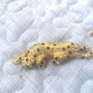 Vintage signed gold tone metal rhinestone black and green enamel jaguar pin